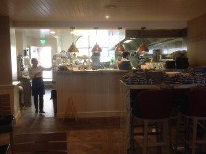 Chefs work in an open-plan kitchen at The Jetty
